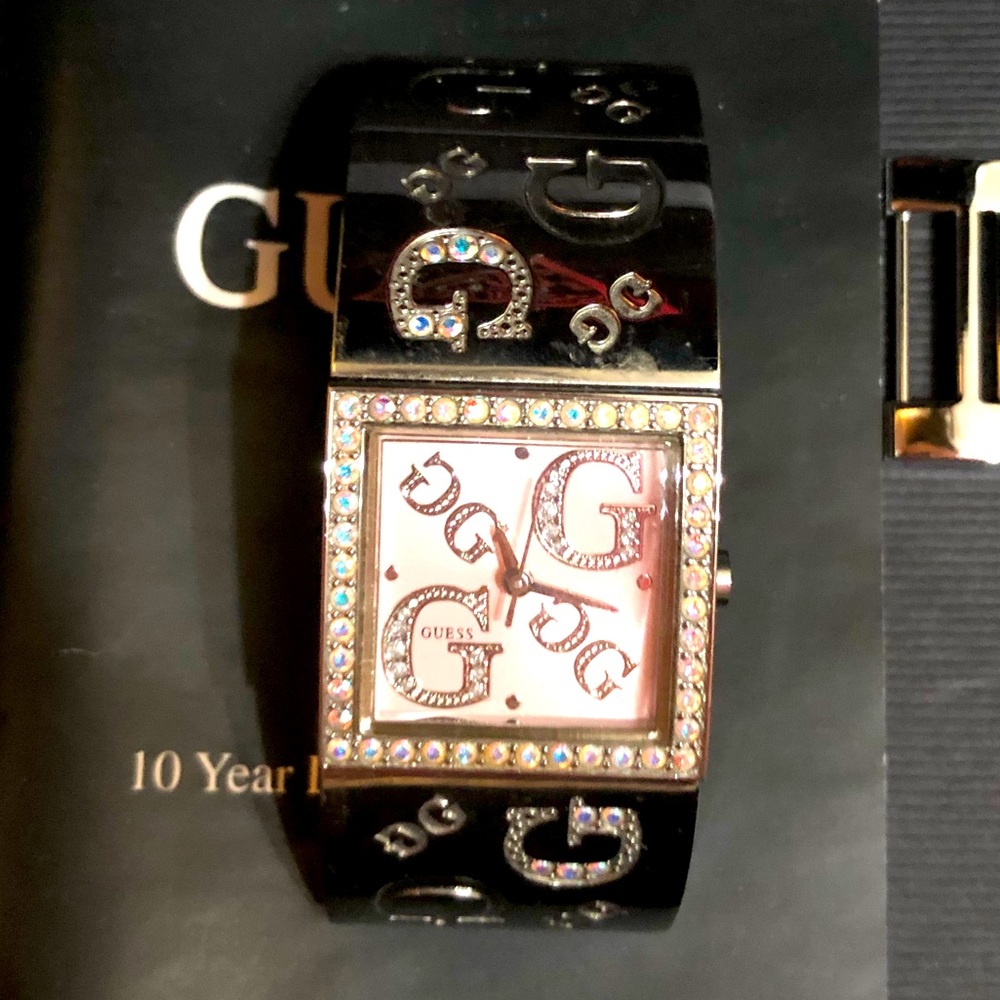 Vintage Guess Watch. Rhinestones and Silver Toned. Like new. Needs Battery.